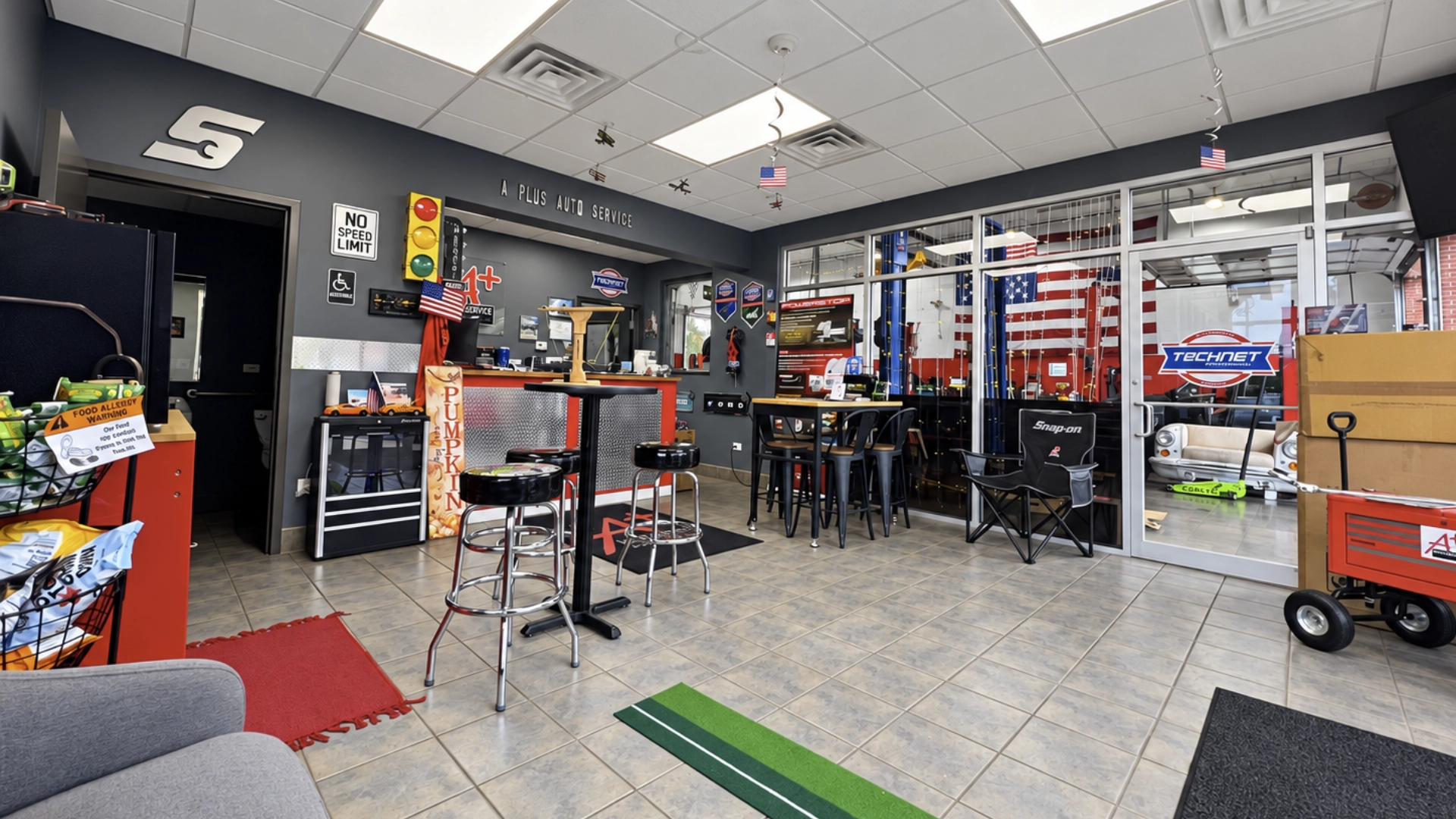 Customer waiting area at A Plus Auto Service in Frankfort, with seating, front counter and windows overlooking the repair bays