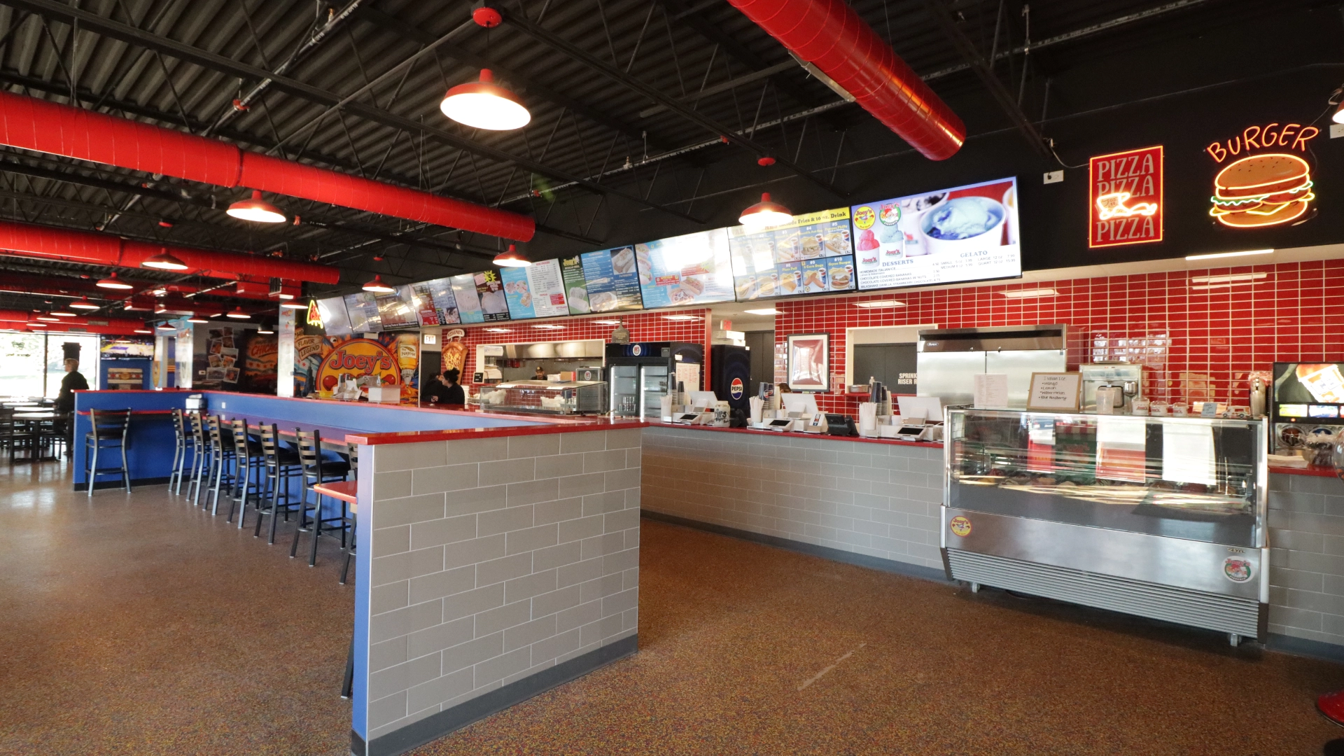 Service counter and menu boards inside the new Joey's Red Hots restaurant in Orland Park